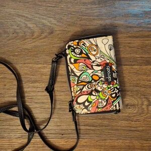 The Sakroots Peace Crossbody Wallet.